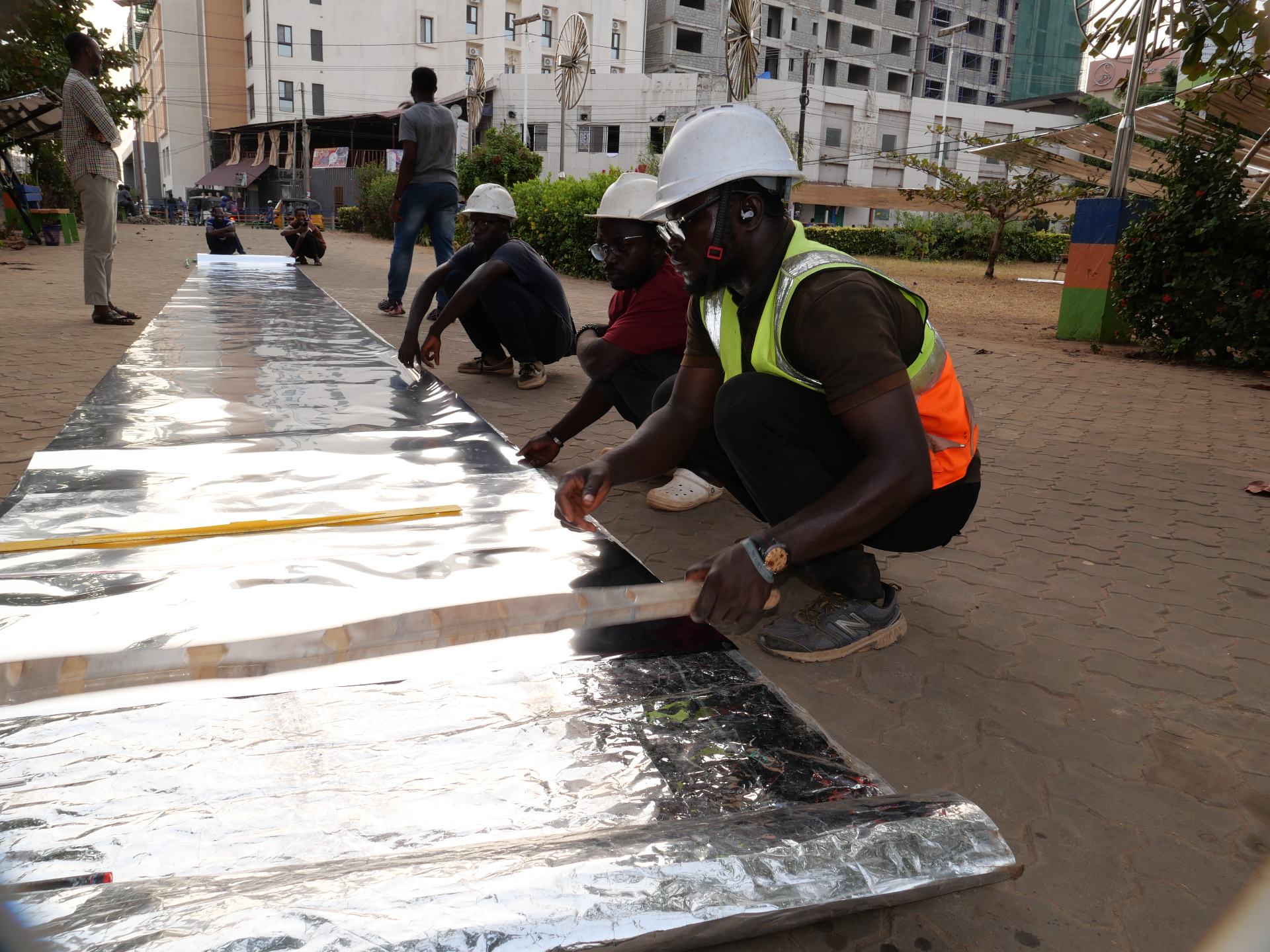 MEER team installing reflective canopy sheeting on-site